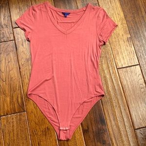 Samon colored body suit